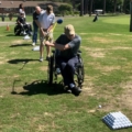 several people with different disabilites golfing